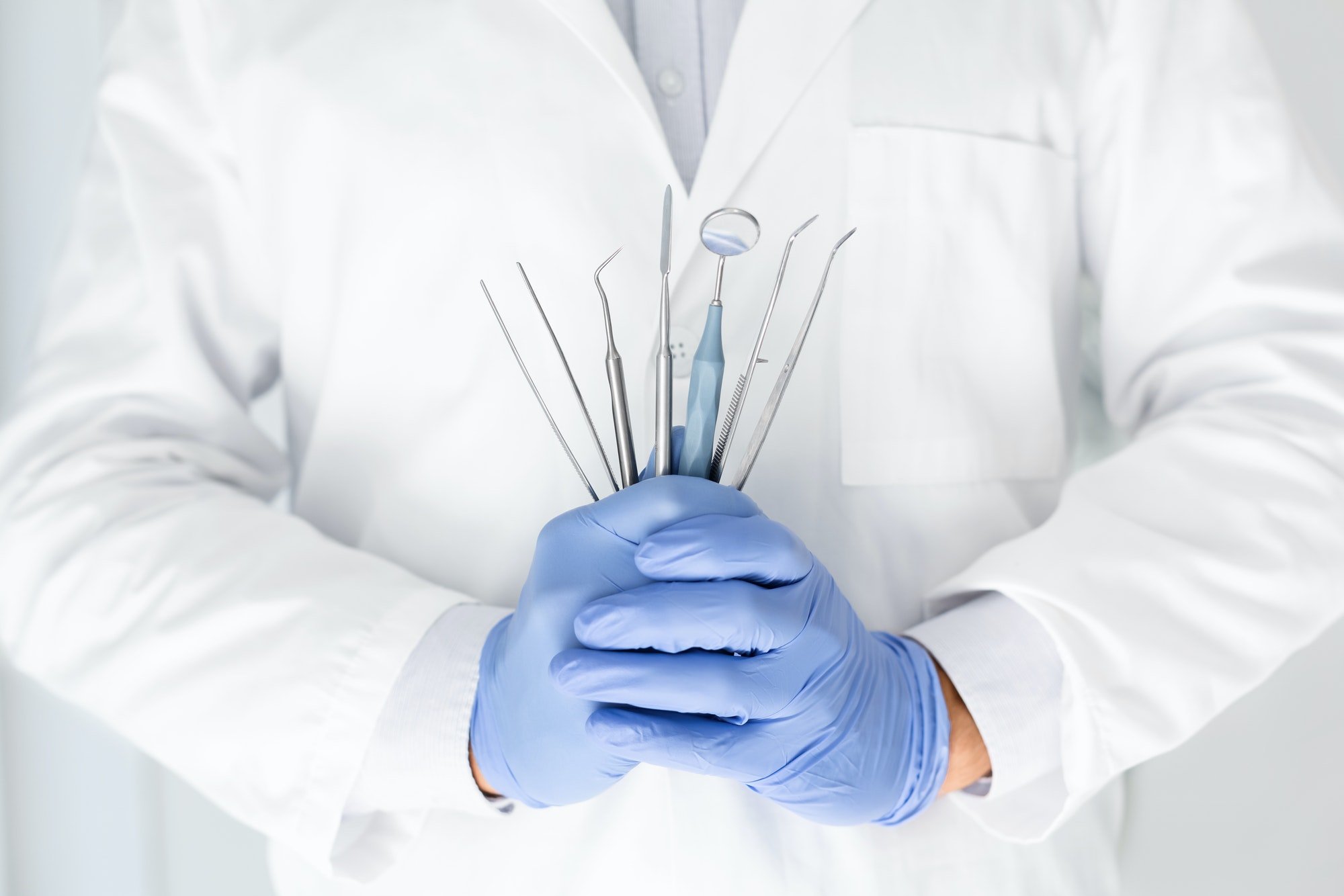 close-up-of-dentist-hands-with-dental-equipment.jpg